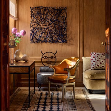 Cozy corner with wooden paneling featuring modern decor elements.