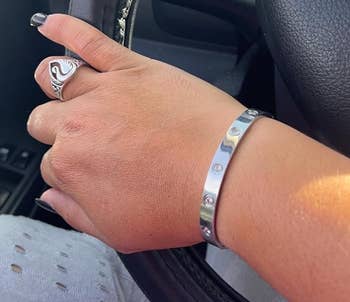 reviewer wearing silver bracelet