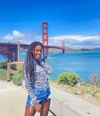 reviewer using tripod to take a picture in front of Golden Gate Bridge
