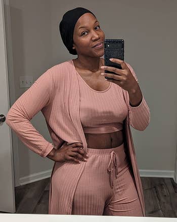 a reviewer wearing the set in light pink 