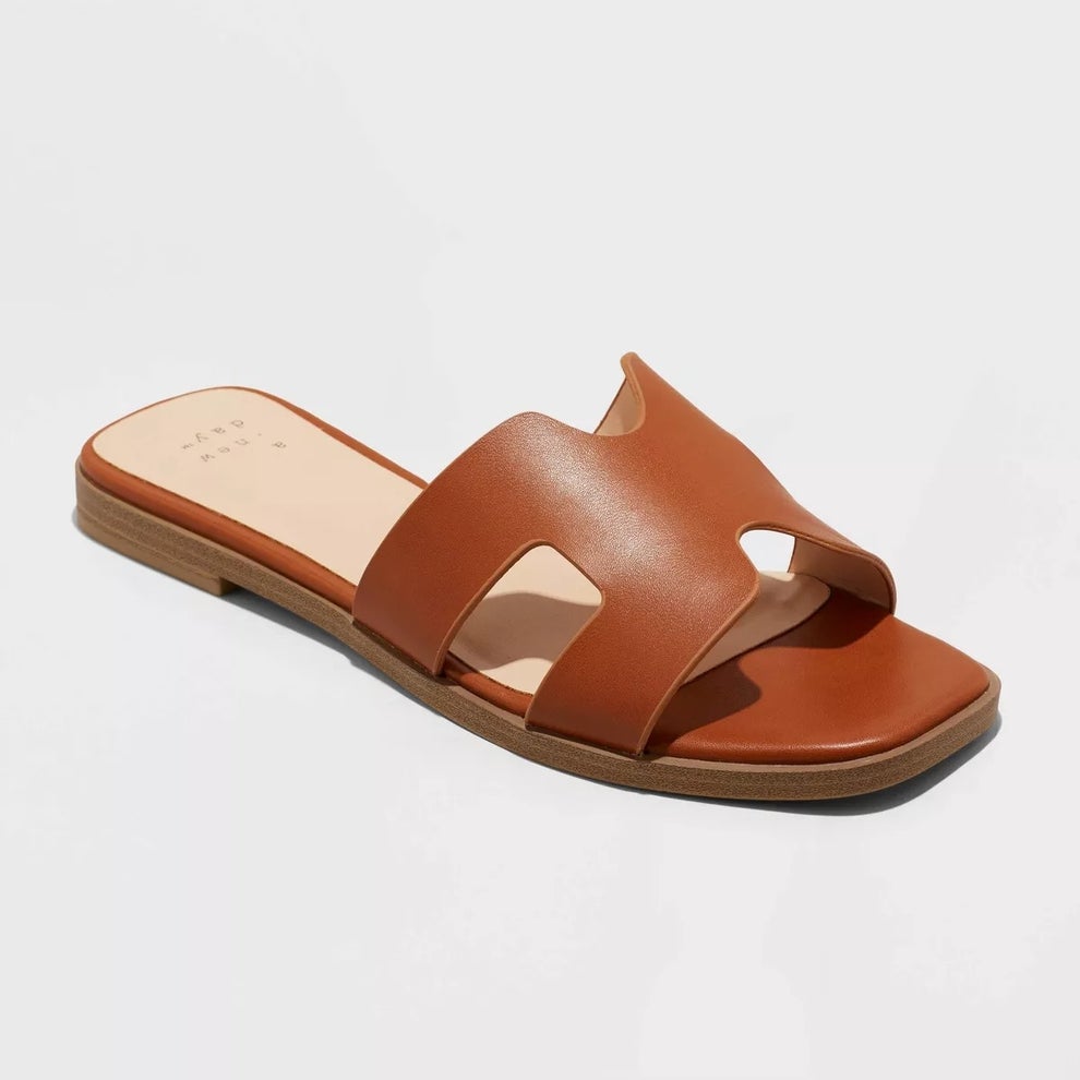 Brown leather slide sandal with open toe and cutout design