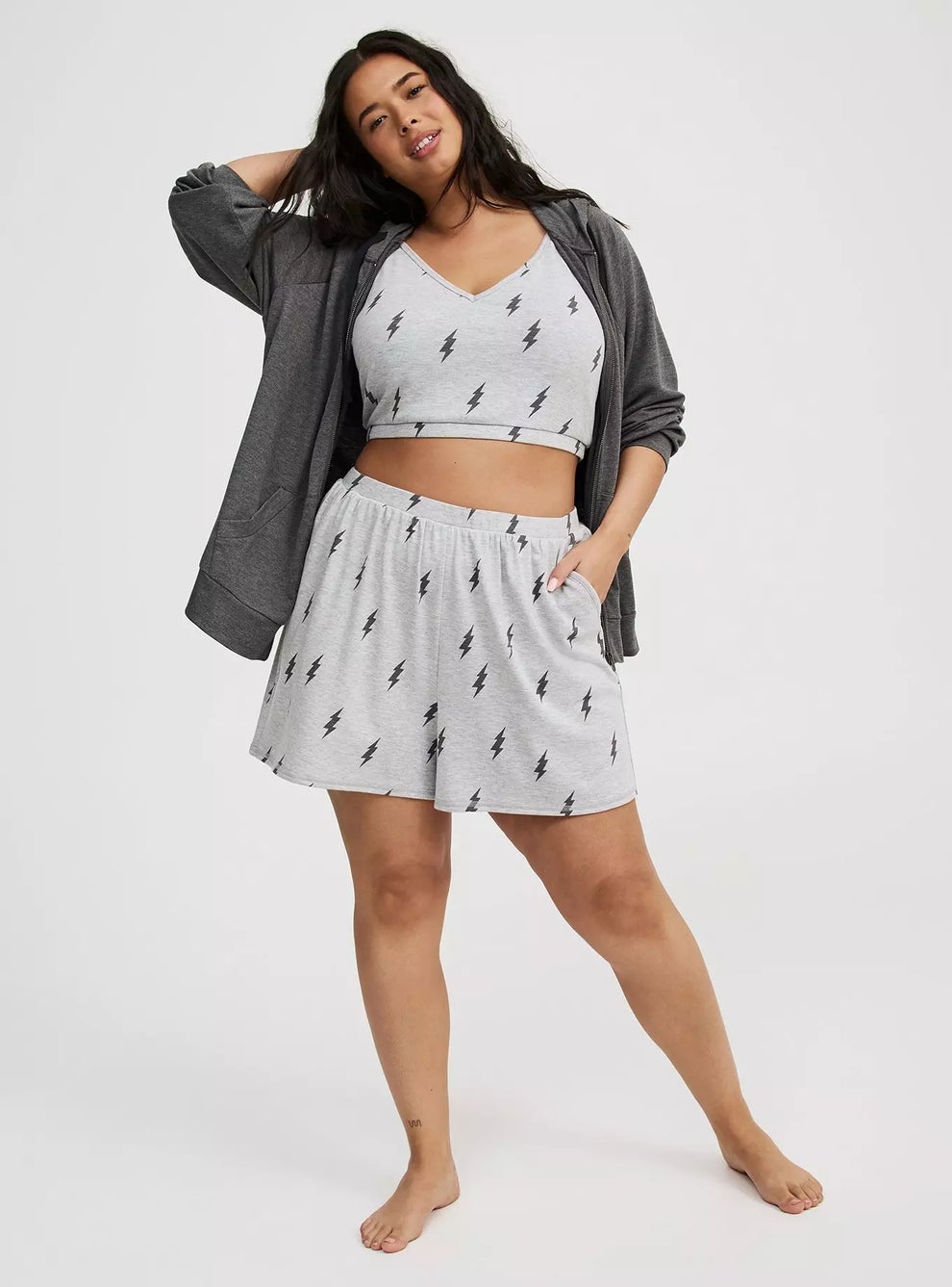Person models a cozy pajama set with a hoodie