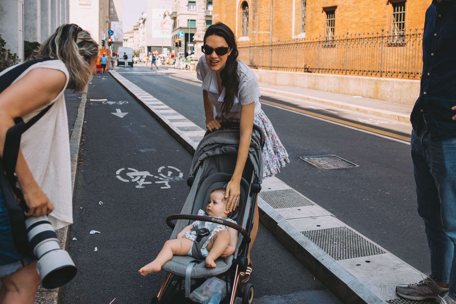 Image may contain Clothing Footwear Shoe Person Adult Baby Accessories Glasses Pushing Car and Transportation