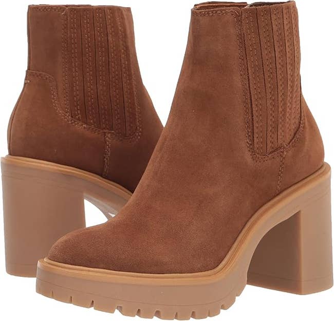 Brown suede ankle boots with chunky high heels and ribbed elastic side panels. Suitable for a stylish, casual look
