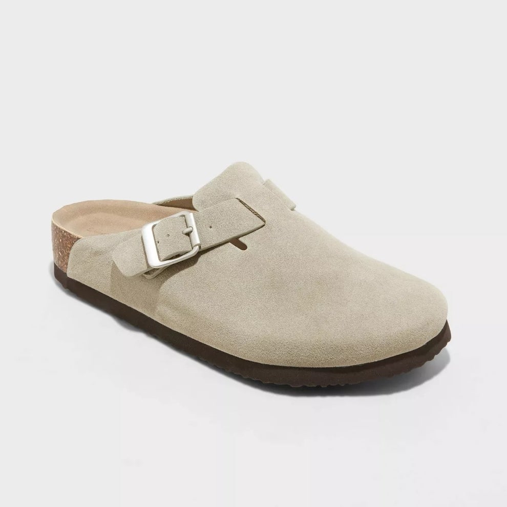 A beige suede-style clog with buckle detail and thick sole