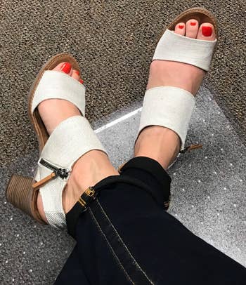overhead view of reviewer wearing the white sandals