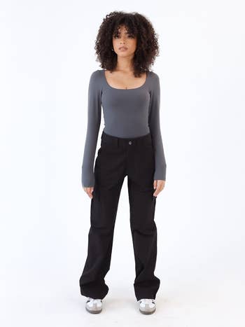 Model wearing the black cargo pants