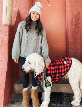 Reviewer wearing a beanie, the grey sweater sweater, and leggings