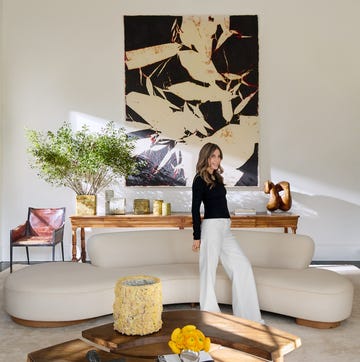 modern living room setup with a statement art piece and stylish furniture