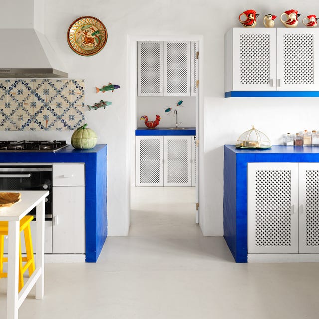 rustic white greek kitchen with blue counter accents