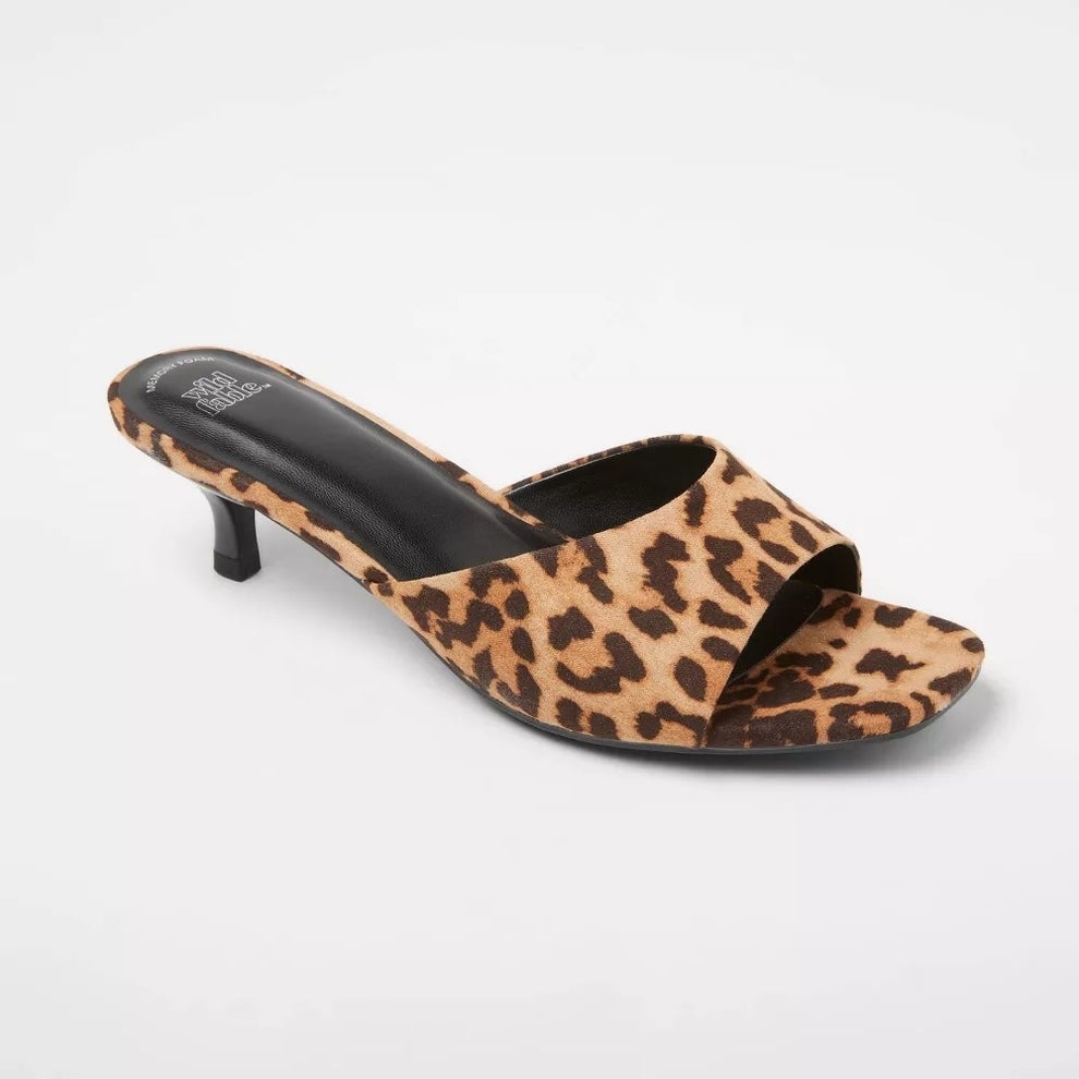 Leopard print sandal with a low heel, featuring an open toe design and a sleek silhouette, ideal for fashion-forward casual or dressy looks