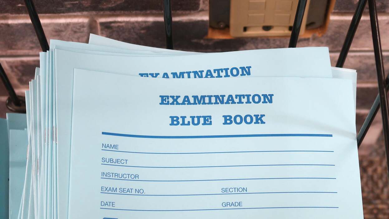 A stack of college exam "blue books" 