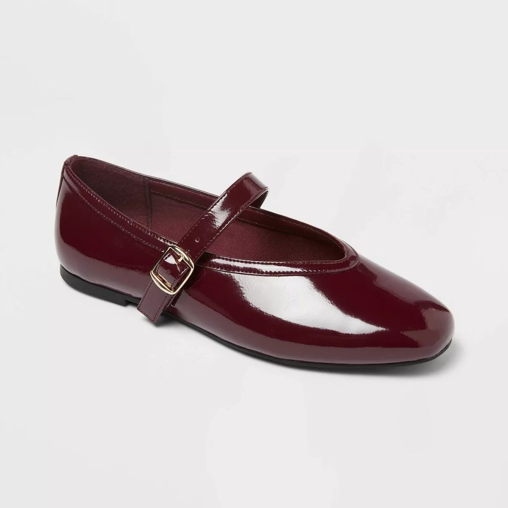 Patent maroon Mary Jane flat shoe with a strap and buckle