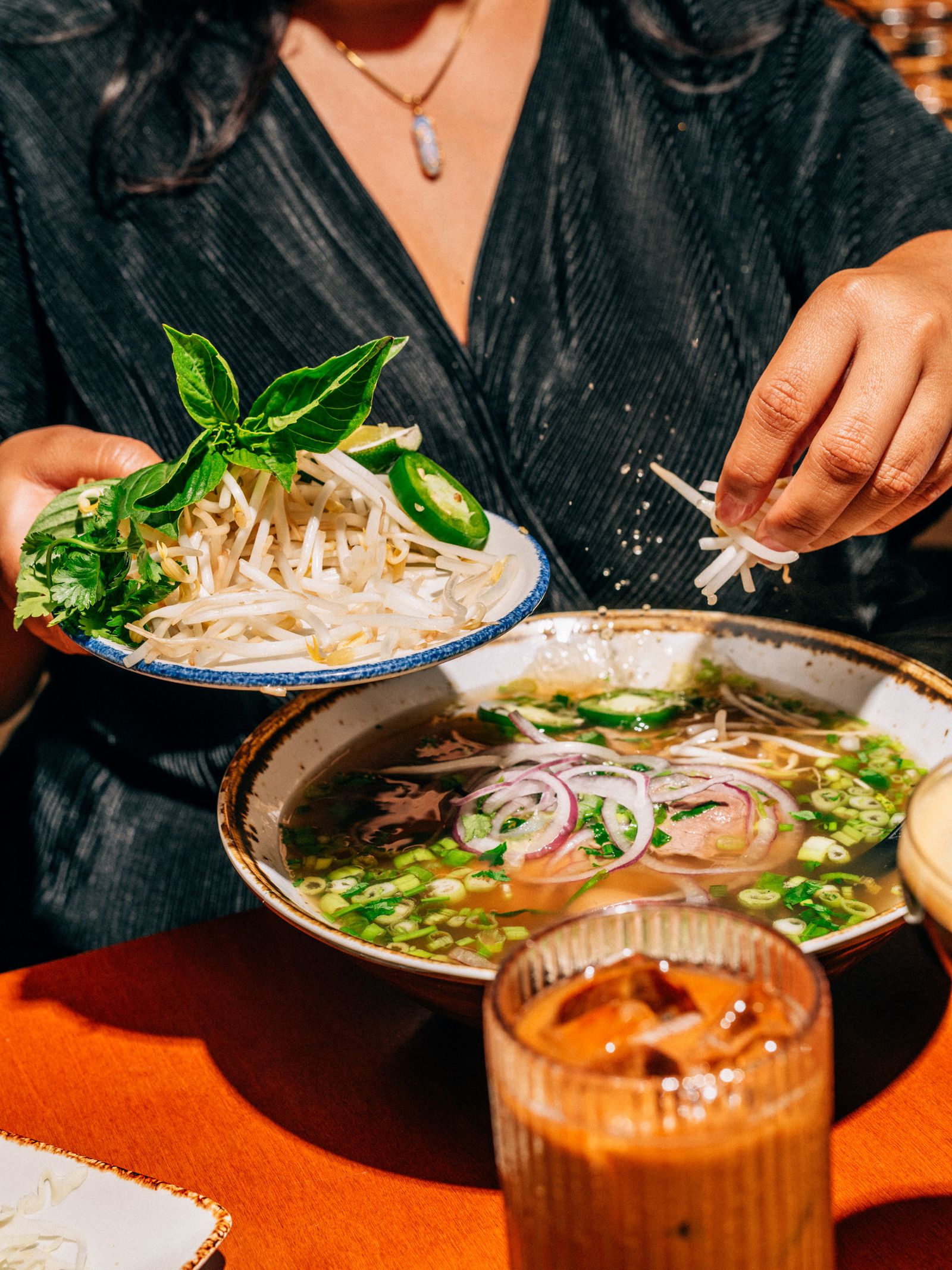 A person adding vegetables
