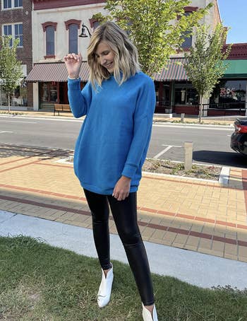reviewer wearing the blue sweater