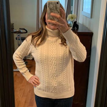 Reviewer wearing white sweater