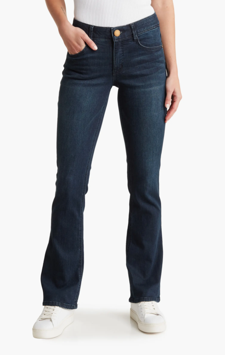 Person wearing dark blue jeans and white sneakers, emphasizing casual style suitable for a shopping context