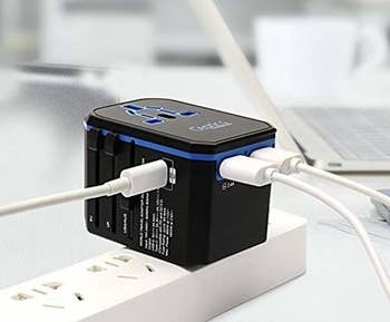 The black charger with USB cords coming out of it